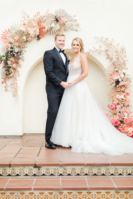 Colorful modern wedding with a killer tropical floral installation