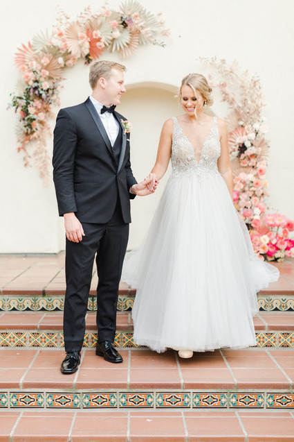 Colorful modern wedding with a killer tropical floral installation
