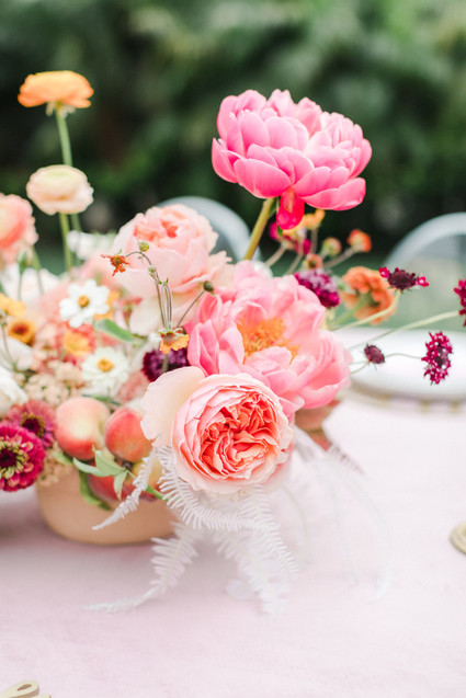 Colorful modern wedding with a killer tropical floral installation
