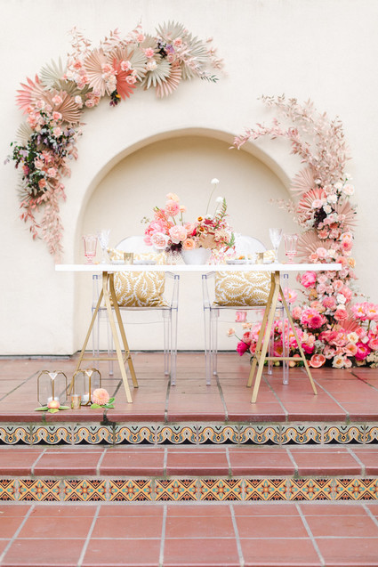 Colorful modern wedding with a killer tropical floral installation