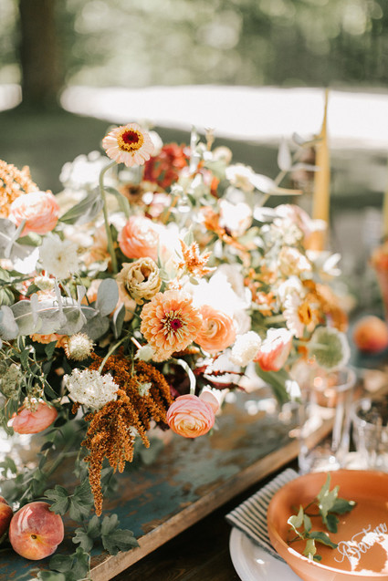 late summer flower arrangement in terracotta and peach
