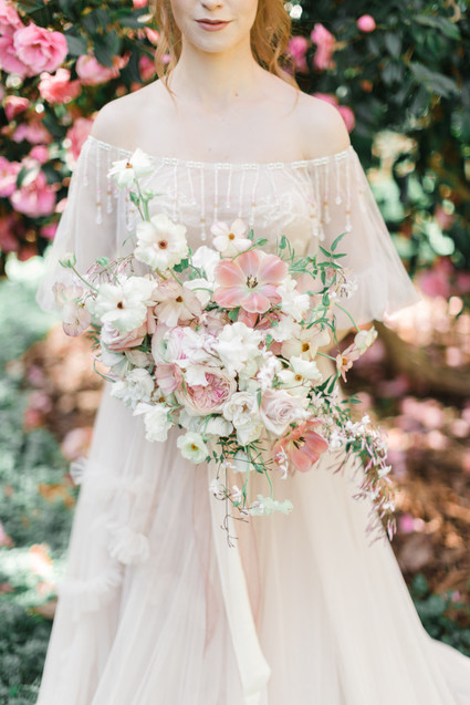 A stunning bridal editorial with a giant pink camellia tree
