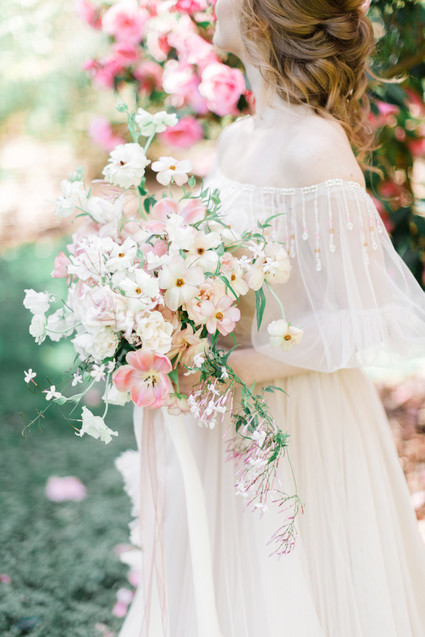 A stunning bridal editorial with a giant pink camellia tree