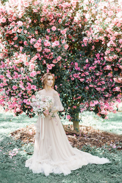 A stunning bridal editorial with a giant pink camellia tree