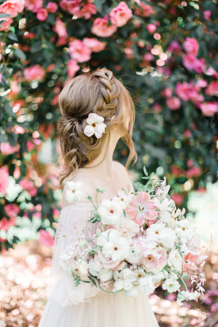 A stunning bridal editorial with a giant pink camellia tree