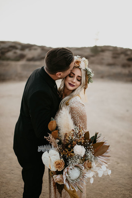 Boho vow renewal with a palm frond teepee at Wolf Feather Honey Farm