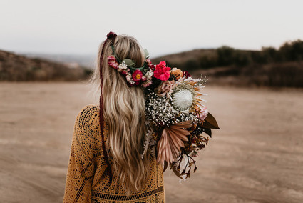 Boho vow renewal with a palm frond teepee at Wolf Feather Honey Farm