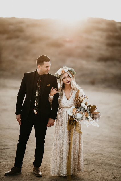Boho vow renewal with a palm frond teepee at Wolf Feather Honey Farm