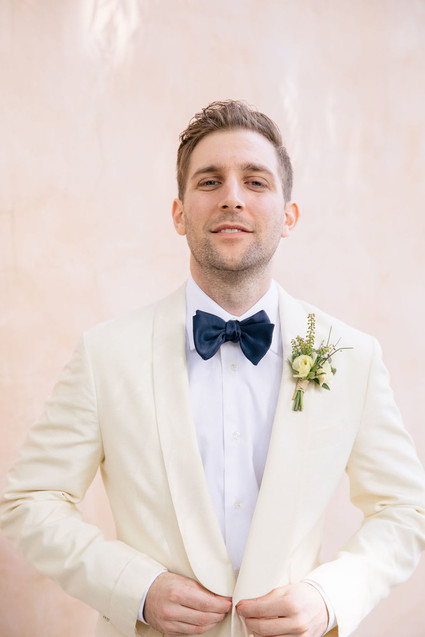 Groom with a white dinner jacket