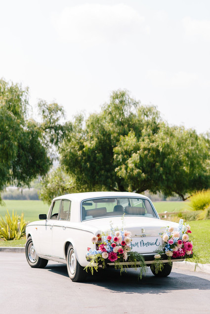 vintage Rolls Royce wedding car with flowers