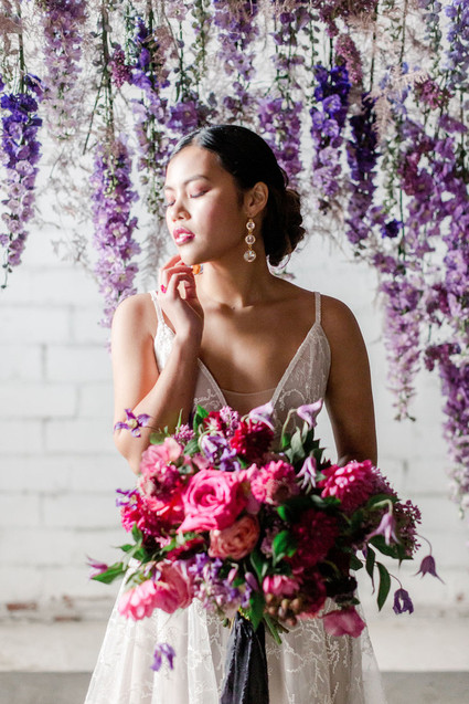 Bright moody spring wedding inspo with a dramatic floral curtain