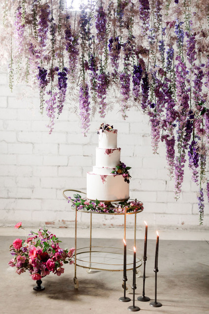 Bright moody spring wedding inspo with a dramatic floral curtain Inspiration