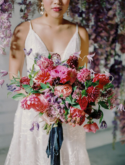 Bright moody spring wedding inspo with a dramatic floral curtain