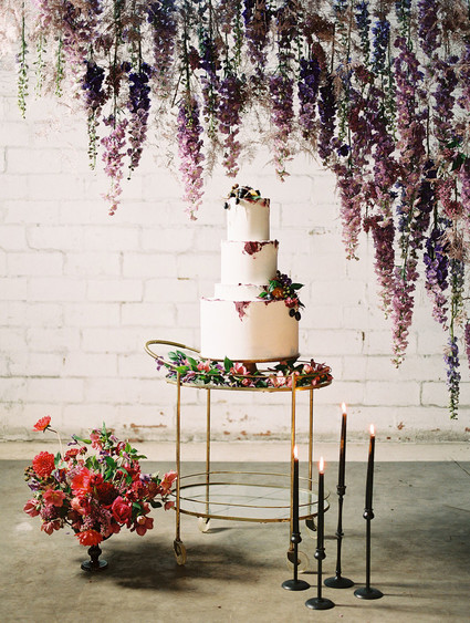 Bright moody spring wedding inspo with a dramatic floral curtain