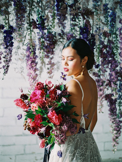 Bright moody spring wedding inspo with a dramatic floral curtain