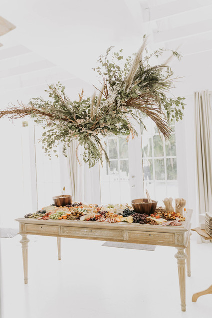 All white olive branch bridal shower with an epic grazing table