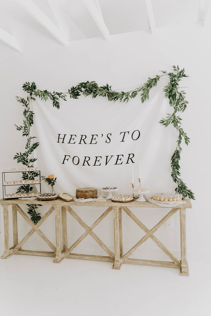 All white olive branch bridal shower with an epic grazing table