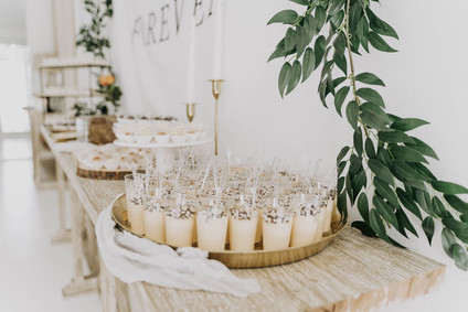 All white olive branch bridal shower with an epic grazing table