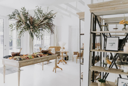 All white olive branch bridal shower with an epic grazing table