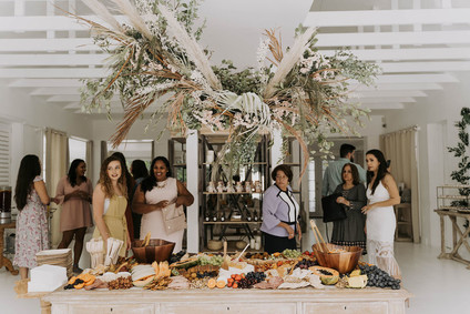 All white olive branch bridal shower with an epic grazing table