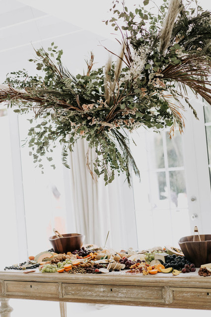 All white olive branch bridal shower with an epic grazing table