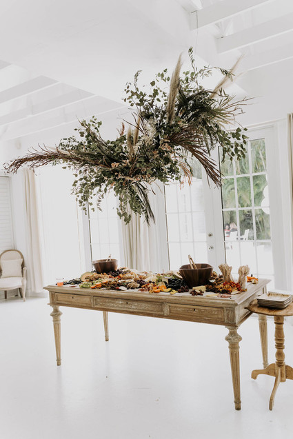 All white olive branch bridal shower with an epic grazing table