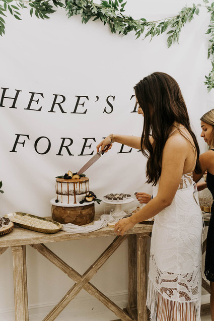 All white olive branch bridal shower with an epic grazing table