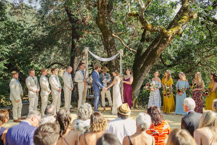 Ceremony with handmade chuppah and floral mandala