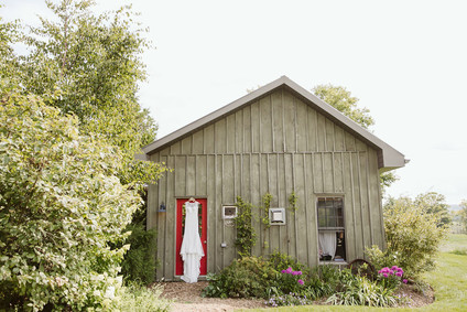 Farm to table summer wedding with pops of red and a PARADE