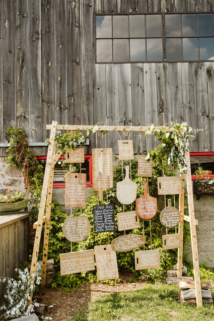 Cutting board seating chart for a farm to table barn wedding