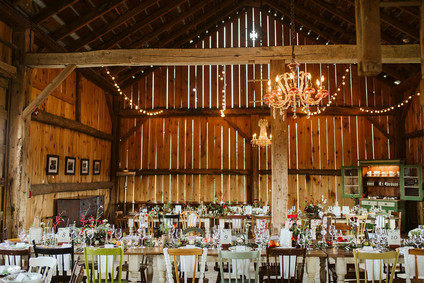 Farm to table summer barn wedding with pops of red and a PARADE