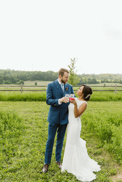 Farm to table summer barn wedding with pops of red and a PARADE