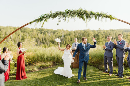 Farm to table summer barn wedding with pops of red and a PARADE