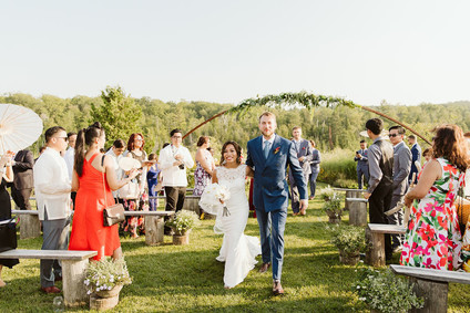Farm to table summer barn wedding with pops of red and a PARADE
