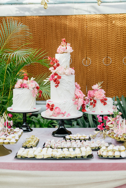 Ruffled floral wedding cake with pink details