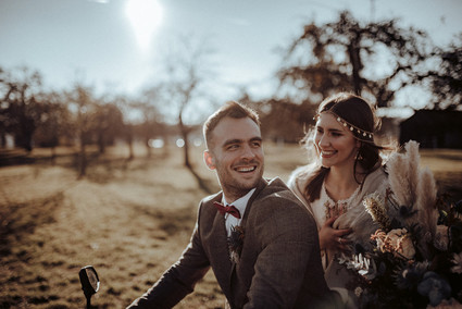 Bride and groom on motorcycle