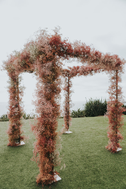 Pink babies breath wedding arch