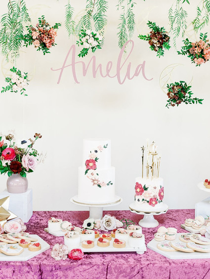 Floral first birthday cakes