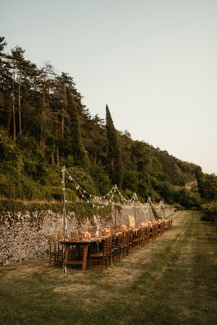 Long outdoor table with string lights