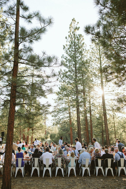 long reception table in forest wedding