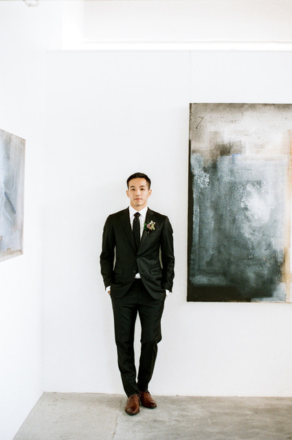 modern black groom's suit