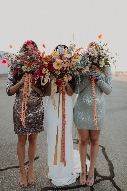 colorful bridal bouquet with feathers