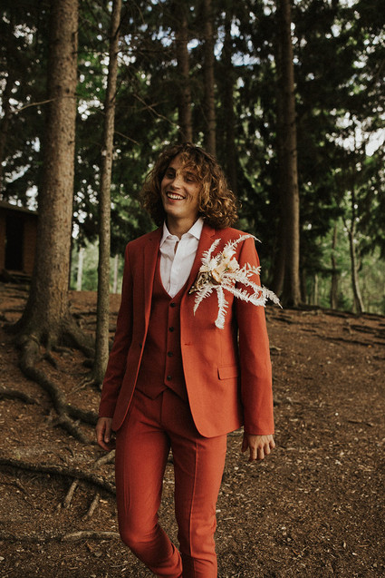 rust colored groom's suit