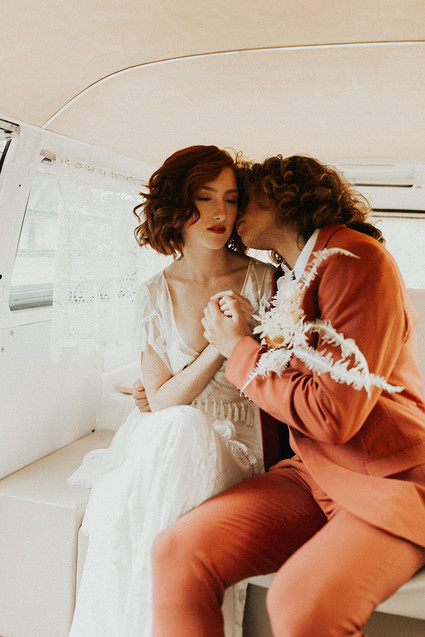 rust colored groom's suit