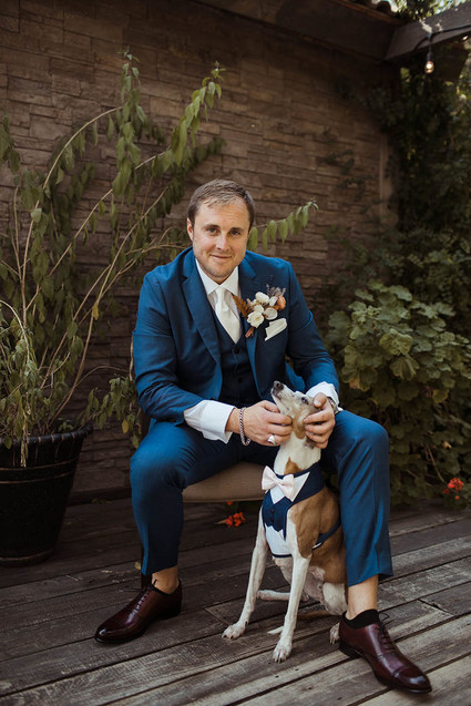 groom with dog