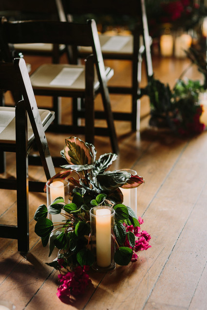 dramatic hollywood wedding ceremony with tropical plants