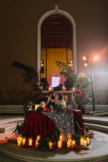 dramatic sweetheart table with candles